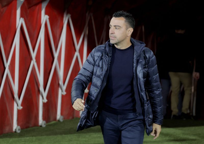 Soccer-Xavi reaches 100 games at the helm of Barca with championship ambitions