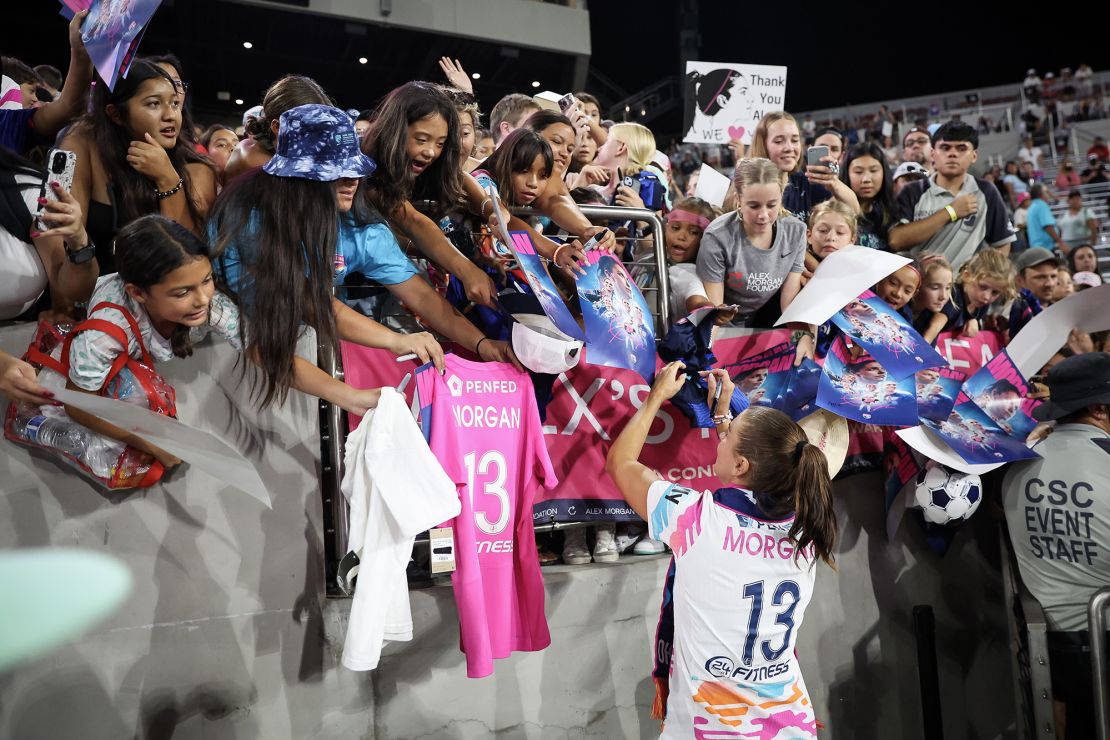 Morgan signing autographs after her final career match.