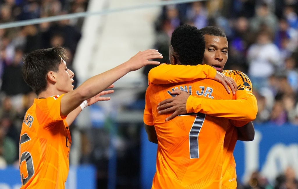 LEGANES, SPAIN - NOVEMBER 24: Kylian Mbappe of Real Madrid celebrates scoring his teams first goal with teammates Vinicius Junior and Arda Gueler during the LaLiga match between CD Leganes and Real Madrid CF at Estadio Municipal de Butarque on November 24, 2024 in Leganes, Spain. (Photo by Angel Martinez/Getty Images)