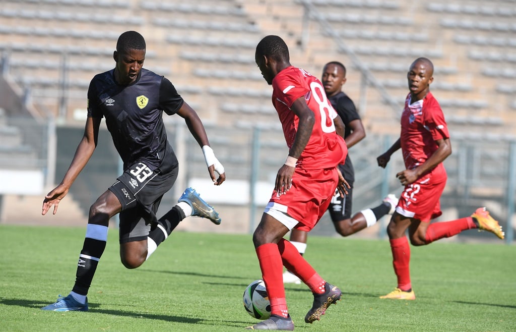 PRETORIA, SOUTH AFRICA - NOVEMBER 03: Tshidiso Patjie of Kruger United and Katekani Mhlongo of Leruma United during the Motsepe Foundation Championship match between Leruma United and Kruger United at Lucas Masterpieces Moripe Stadium on November 03, 2024 in Pretoria, South Africa. (Photo by Lefty Shivambu/Gallo Images)