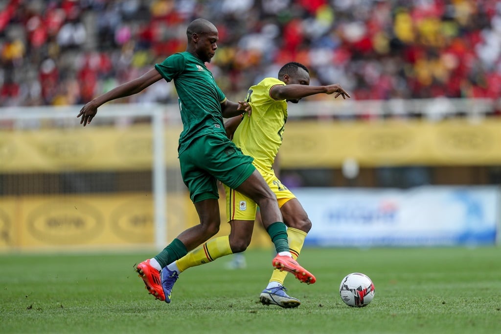 KAMPALA, UGANDA - NOVEMBER 15: Evidence Makgopa and South Africa and Taddeo Lwanga of Uganda during the 2025 Africa Cup of Nations, Qualifier match between Uganda and South Africa at Mandela National Stadium on November 15, 2024 in Kampala, Uganda. (Photo by Hassan Wamwayi/Gallo Images)