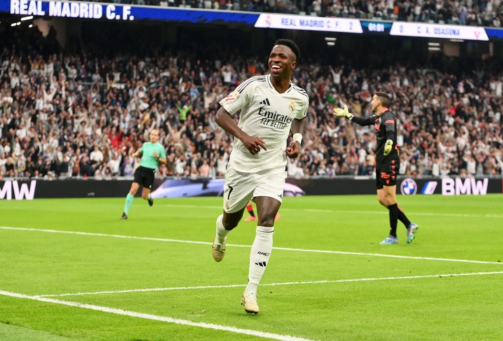 MADRID, SPAIN - NOVEMBER 09: Vinicius Junior of Real Madrid celebrates scoring his teams third goal during the LaLiga match between Real Madrid CF and CA Osasuna at Estadio Santiago Bernabeu on November 09, 2024 in Madrid, Spain. (Photo by Denis Doyle/Getty Images)