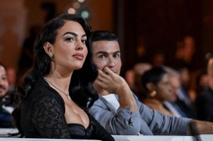 DUBAI, UNITED ARAB EMIRATES - DECEMBER 27: Al-Nassr player Cristiano Ronaldo (2nd L) and Georgina Rodriguez (L) attend the Globe Soccer Dubai Awards 2024 as part of the Dubai International Sports Conference 2024 in Dubai, United Arab Emirates (UAE) on December 27, 2024. (Photo by Waleed Zein/Anadolu via Getty Images)