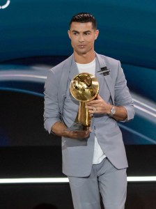 DUBAI, UNITED ARAB EMIRATES - DECEMBER 28: Al-Nassr player Cristiano Ronaldo receives an award during the Globe Soccer Dubai Awards 2024 as a part of the Dubai International Sports Conference 2024 in Dubai, United Arab Emirates (UAE) on December 28, 2024. (Photo by Waleed Zein/Anadolu via Getty Images)