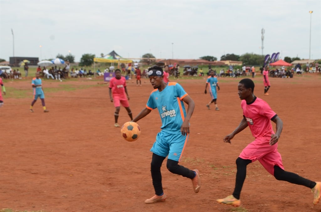 Via Vosloo thrashed Ngozi FC (wearing blue soccer kit)  by 4-2, in the matches played at Vosloorus Ground D. Photo by Happy Mnguni