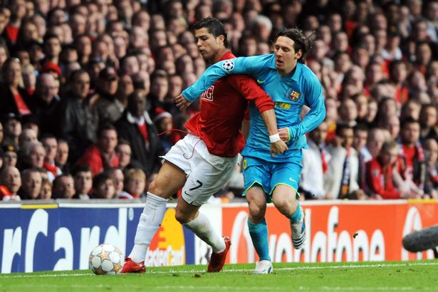 Cristiano Ronaldo of Manchester United and Lionel Messi of Barcelona compete for the ball during the UEFA Champions League Semi Final second leg match between Manchester United and Barcelona at the Old Trafford on April 29, 2008 in Manchester, England.