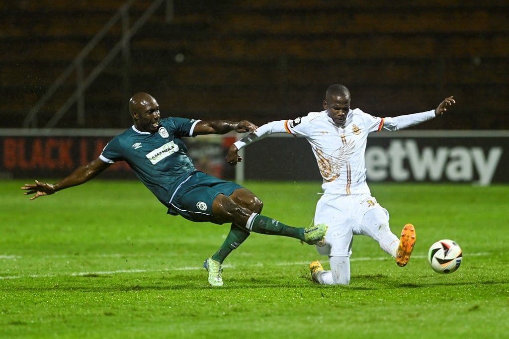 DURBAN, SOUTH AFRICA - DECEMBER 13: Etiosa Godspower Ighodaro of AmaZulu FC and Sbangani Zulu of Royal AM during the Betway Premiership match between AmaZulu FC and Royal AM at Moses Mabhida Stadium on December 13, 2024 in Durban, South Africa. (Photo by Darren Stewart/Gallo Images),?øäøZ?þ­