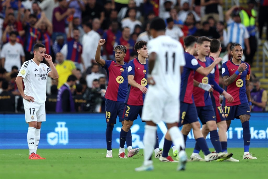 JEDDAH, SAUDI ARABIA - JANUARY 12: Lamine Yamal of FC Barcelona celebrates scoring his teams first goal with teammates during the Spanish Super Cup Final between Real Madrid and FC Barcelona at King Abdullah Sports City on January 12, 2025 in Jeddah, Saudi Arabia. (Photo by Yasser Bakhsh/Getty Images)