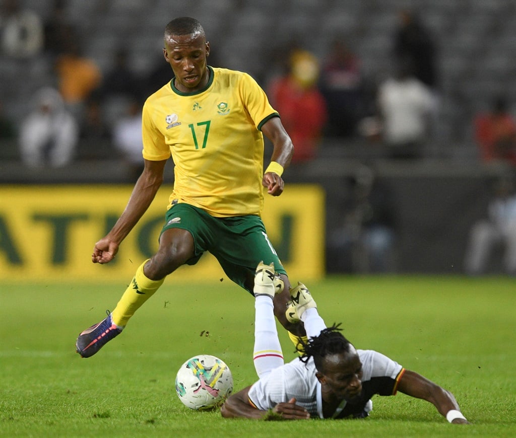 Elias Mokwana of South Africa challenges Abdu Aziizi Kayanda of Uganda during the 2025 Africa Cup of Nations Qualifiers match between  South Africa and Uganda at Orlando Stadium in Soweto on 06 September 2024  