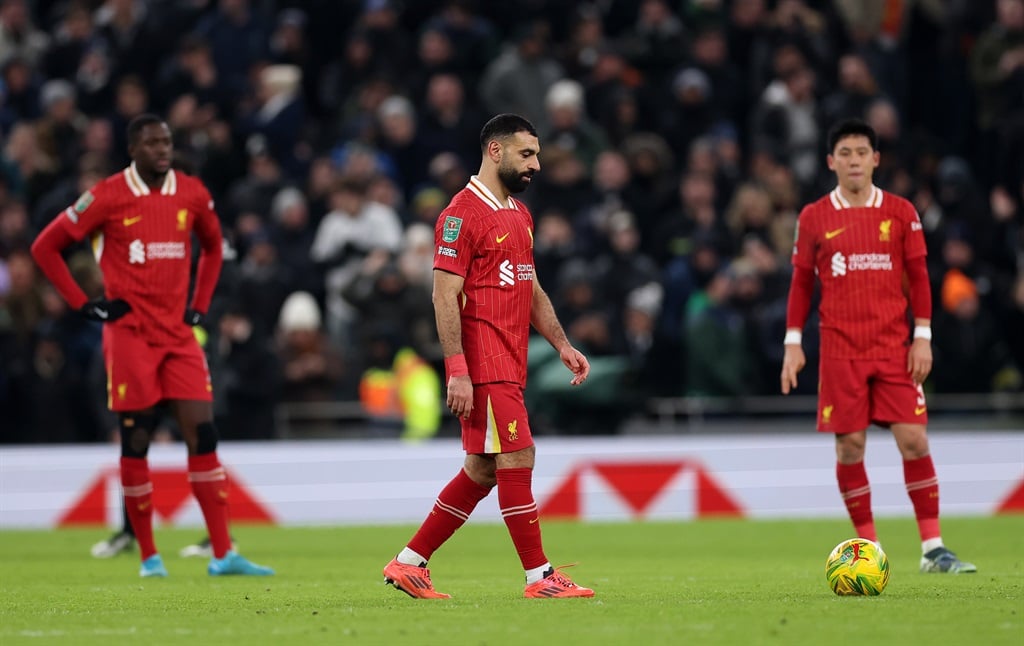 LONDON, ENGLAND - JANUARY 08: Mohamed Salah of Liverpool reacts after Lucas Bergvall of Tottenham Hotspur (not pictured) scores his sides first goal during the Carabao Cup Semi Final First Leg match between Tottenham Hotspur and Liverpool at Tottenham Hotspur Stadium on January 08, 2025 in London, England. (Photo by Julian Finney/Getty Images)