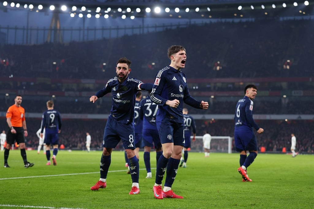 LONDON, ENGLAND - JANUARY 12: Bruno Fernandes of Manchester United celebrates scoring the first goal with Alejandro Garnacho during the Emirates FA Cup Third Round match between Arsenal and Manchester United at Emirates Stadium on January 12, 2025 in London, England. (Photo by Marc Atkins/Getty Images)