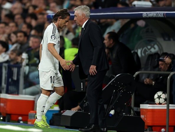 MADRID, SPAIN - NOVEMBER 05: Luka Modric of Real Madrid interacts with Carlo Ancelotti, Head Coach of Real Madrid, after being substituted during the UEFA Champions League 2024/25 League Phase MD4 match between Real Madrid C.F. and AC Milan at Estadio Santiago Bernabeu on November 05, 2024 in Madrid, Spain. (Photo by Florencia Tan Jun/Getty Images)