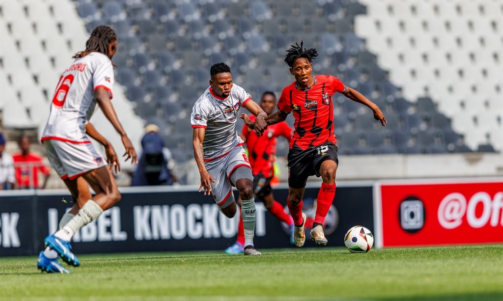 NELSPRUIT, SOUTH AFRICA - OCTOBER 20: Sephelo Baloni of Chippa United Football Club asnd Puso Dithejane of TS Galaxy FC during the Carling Knockout, Last 16 match between TS Galaxy FC and Chippa United at Mbombela Stadium on October 20, 2024 in Nelspruit, South Africa. (Photo by Dirk Kotze/Gallo Images)