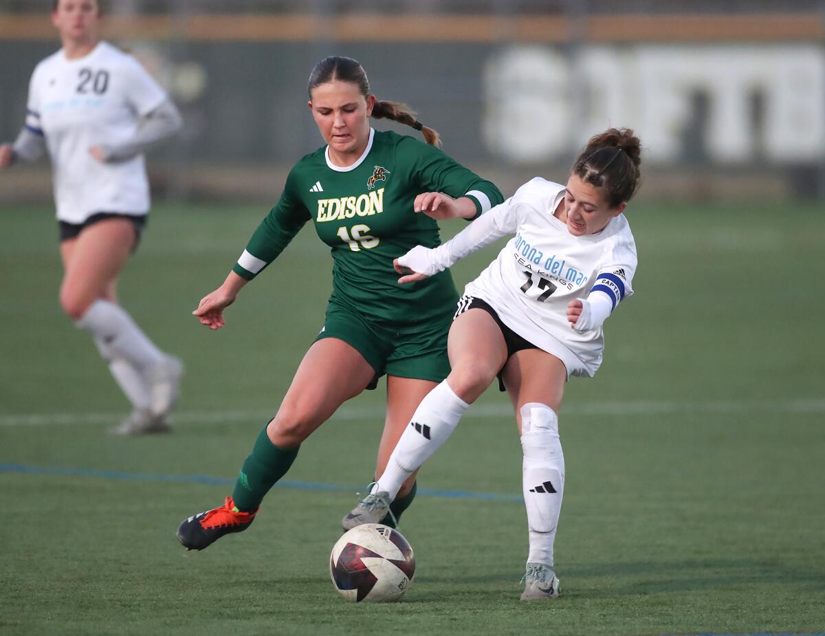 Edison's Ayla Khoshkbariie (16) and CdM's Bella Thomas (17) battle in the Sunset League girls' soccer tournament on Thursday.