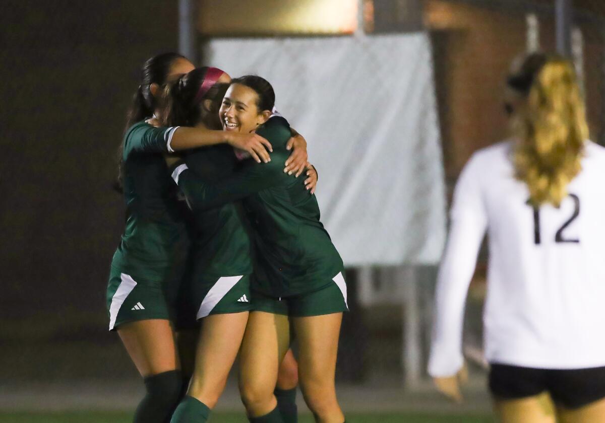 Edison's Lauren Green, far right, celebrates with teammates after scoring a goal against Corona del Mar on Thursday.
