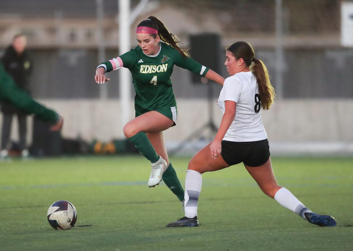 Edison's Lola Coderre (4) steals a ball from CdM's Jenna Hannum during Thursday's match.