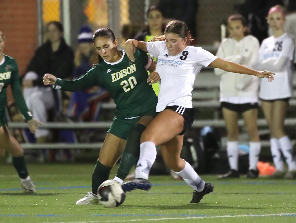 Edison's Olivia Romero-Green (20) battles CdM's Jenna Hannum (8) for a loose ball during Thursday's match.