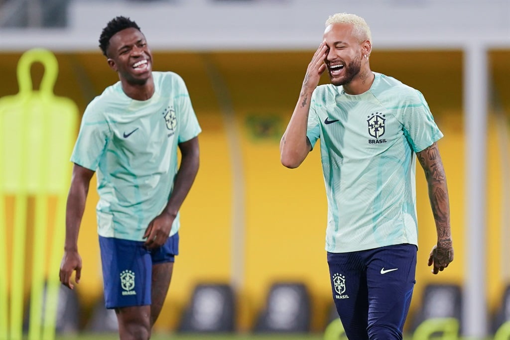 DOHA, QATAR - DECEMBER 08: Neymar and Vinicius Junior of Brasil joke during a training session on match day -1 at Al Arabi SC Stadium on December 8, 2022 in Doha, Qatar. (Photo by Khalil Bashar/Jam Media/Getty Images)