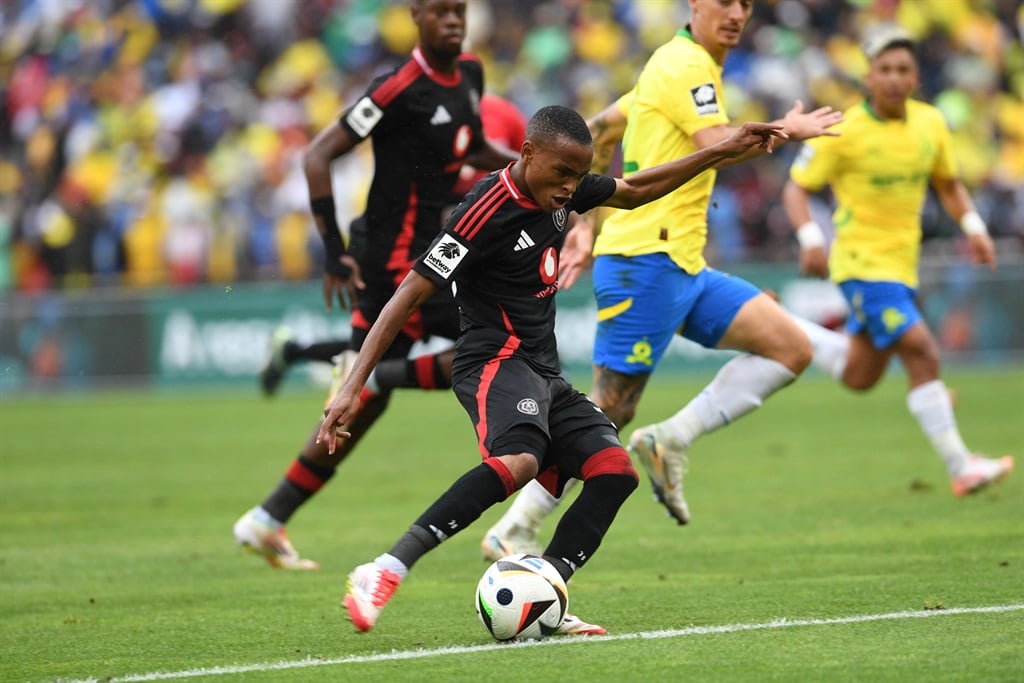 JOHANNESBURG, SOUTH AFRICA - MARCH 16: Lucas Suarez of Mamelodi Sundowns and Relebohile Mofokeng of Orlando Pirates