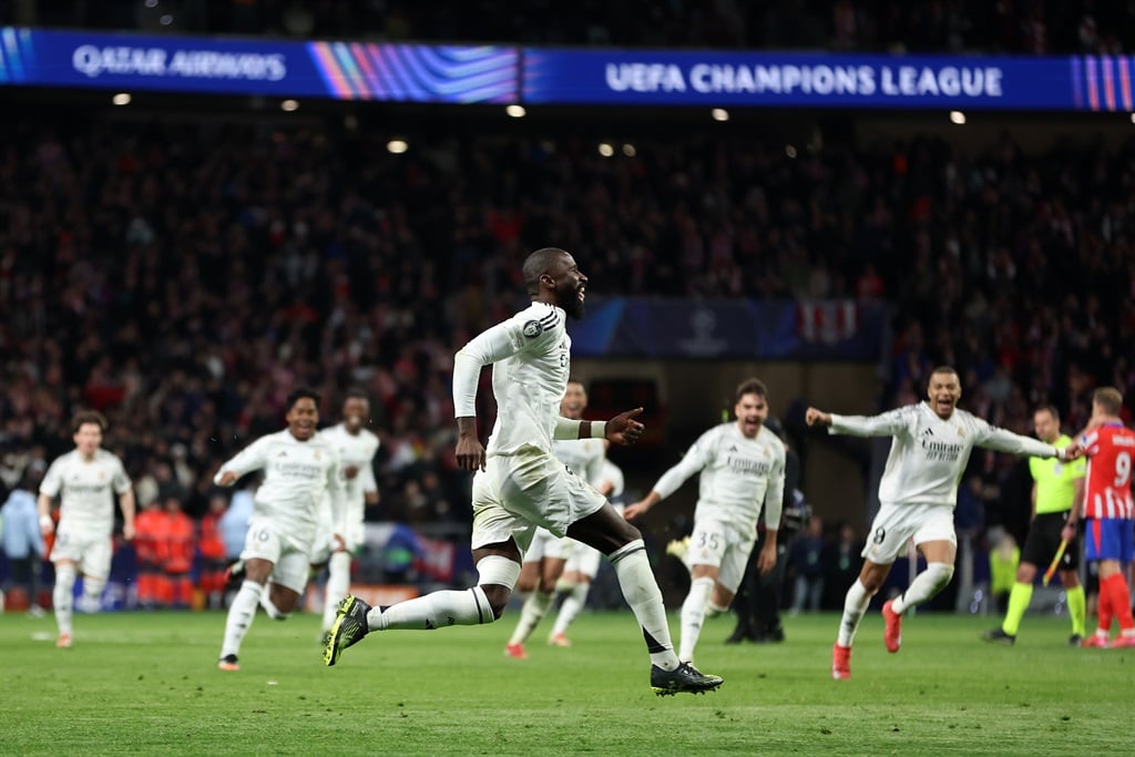 MADRID, SPAIN - MARCH 12: Antonio Ruediger of Real Madrid celebrates after scoring the sides fifth and winning penalty in the penalty shoot out during the UEFA Champions League 2024/25 Round of 16 second leg match between Atletico de Madrid and Real Madrid C.F. at Estadio Metropolitano on March 12, 2025 in Madrid, Spain. (Photo by Florencia Tan Jun/Getty Images)