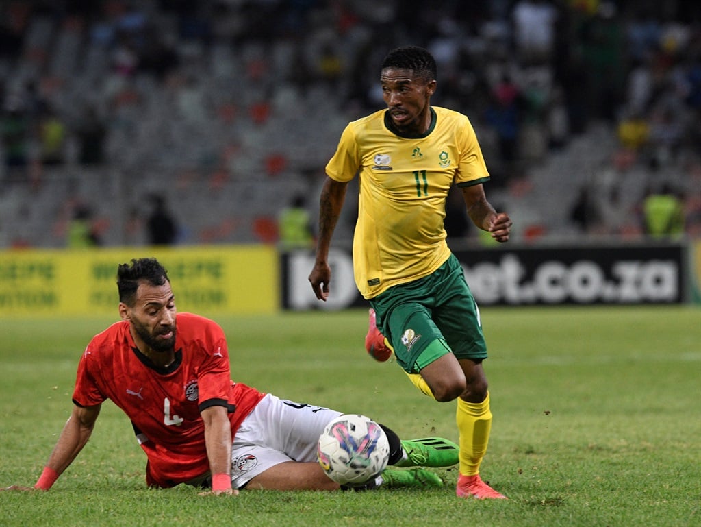 Monnapule Saleng of South Africa challenged by Mohamed Gaber Mohamed Sayed of Egypt during the 2025 CHAN Qualifiers match between South Africa and Egypt on 02 March 2025 at the Free State Stadium in Bloemfontein 